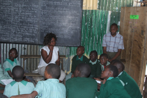 Children and teachers as Furaha Community Center discuss their nighbourhood