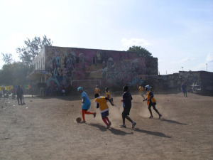 Children playing in Austin's playground. Austin, a Mathare footballer, organized the kids to clean up a dumping ground to make a place to play.